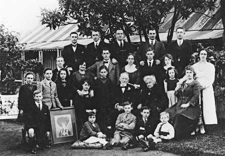 , The extended White family gather in the front garden of Don Bank Cottage for 50th wedding anniversary of James and Johanna (seated in centre) in 1919. Thomas and Catherine, who were living there, are on the far right back and middle row. Stanton Library