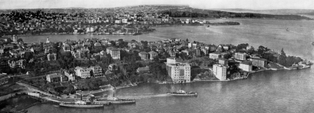 , Kirribilli is shown here from the top of the newly erected arch of the Sydney Harbour Bridge around 1932, just as it was being transformed by the construction of flats. ‘Beulah Flats’ is the large white waterfront building. It had been converted into a hotel in 1928. Stanton Library