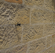 , Detail of original 'bitch picked' stone on the side wall of 'Henbury Villa'. Photograph by Ian Hoskins, 2014
