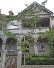 , 'Erinoor', at No.29 Walker Street, North Sydney, is one in a row of seven terrace dwellings built around 1900 in a Federation 'freestyle' which combined elements of English Revival, such as the shingles and half timbered gables, with more continentally-inspired details such as the arches which form a loggia along the length of the entire terrace. No.29 was first owned and occupied by Gordon McKinnon, who was possibly the architect of the terrace. Photograph by Ian Hoskins