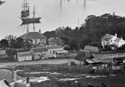 , This detail from Charles Bayliss' 1875 panorama of Sydney Harbour shows timber and stone cottages of the sort that would have characterised the area from the 1850s. State Library of New South Wales