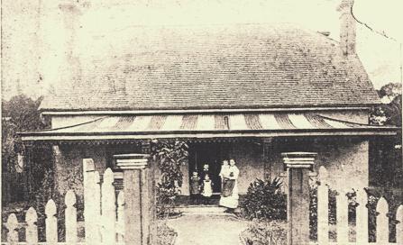 , This 1872 photograph shows the newly built 'Roseleigh' with its original front veranda of corrugated iron roof typically painted in broad stripes and filigree iron valance and grilles supporting the roof. The Georgian symmetry of the house is reflected in the planting of the garden. Stanton Library